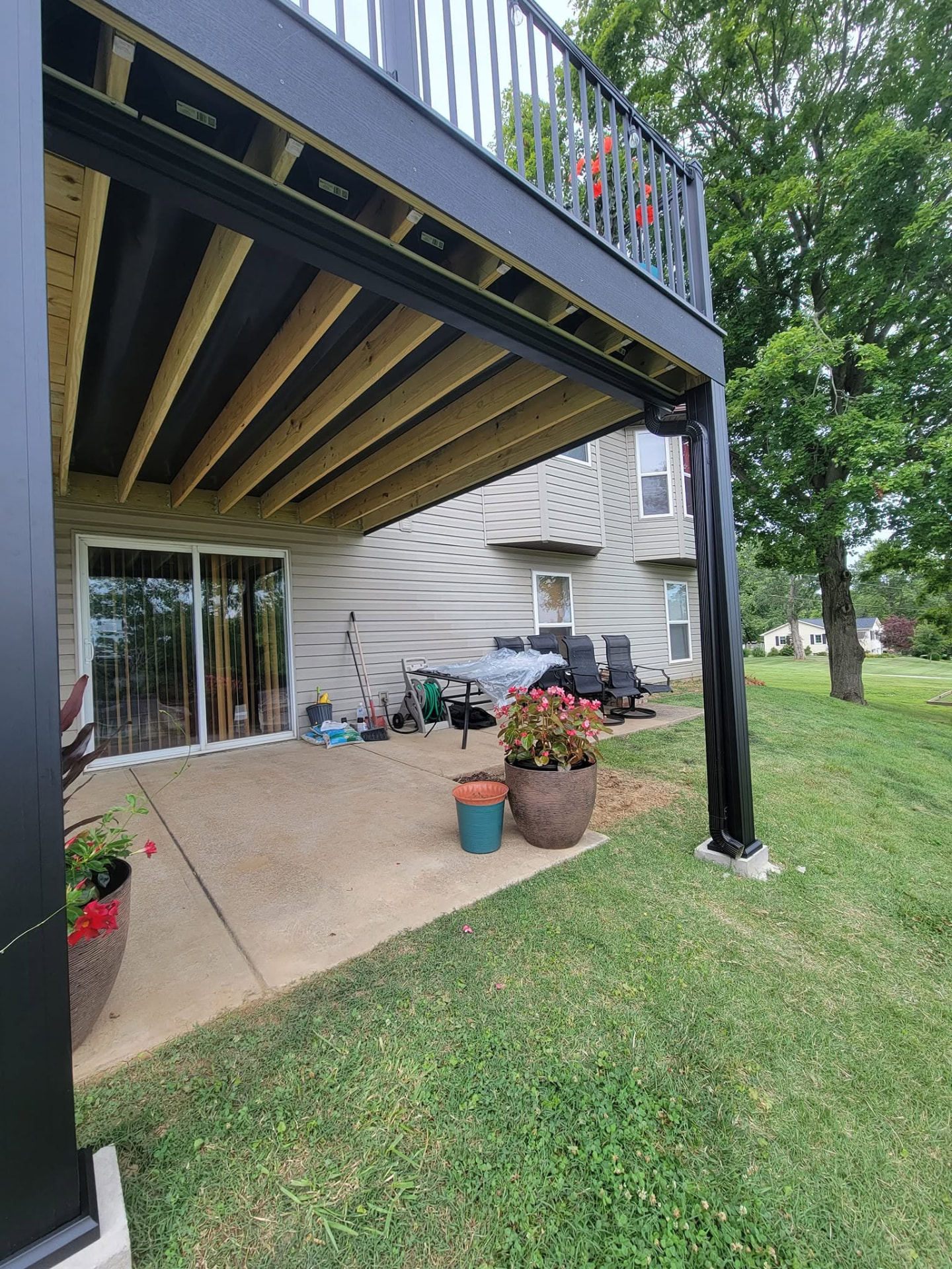 Full Trex RainEscape system under the deck — the patio below stays dry in any weather by B&R Construction