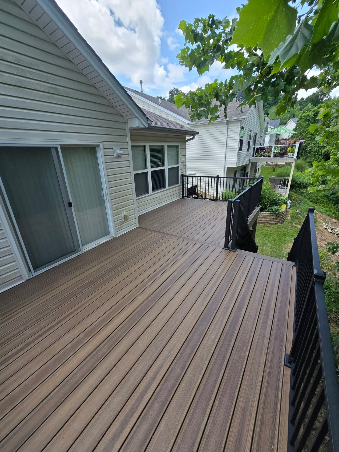 Complete demo and rebuild — new maintenance-free Envision composite deck in Rockaway Beach by B&R Construction