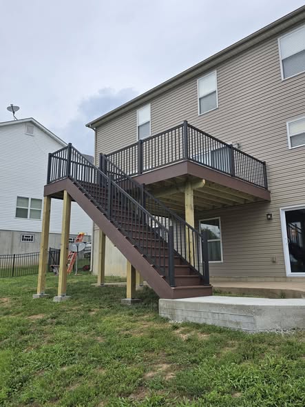 Envision Shaded Auburn composite deck with black aluminum rail and stairs by B&R Construction