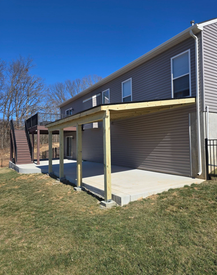 20' × 12' covered lean-to — the perfect chill-and-grill area off the back of the house by B&R Construction