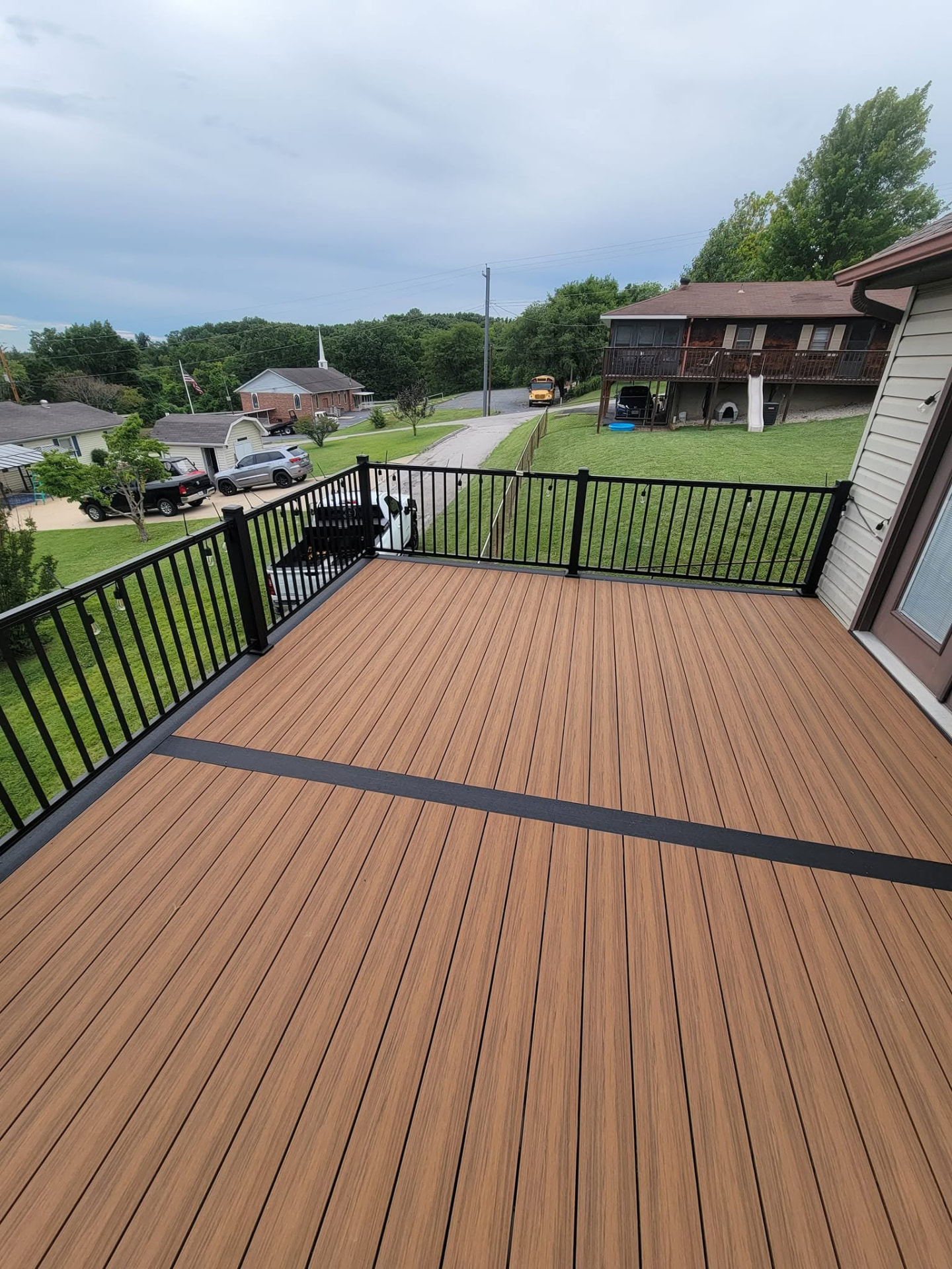 Slate picture-frame border framing the Sedona field on the 20' × 14' Decorators deck by B&R Construction