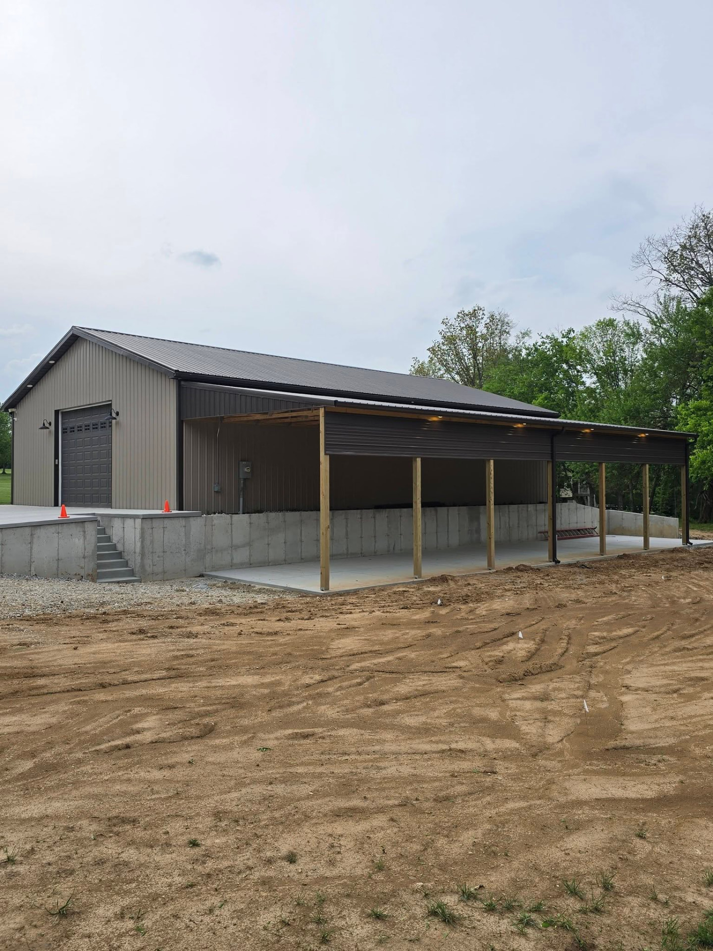 Lean-to built alongside the shop — 128' of footings, short walls, and flatwork by CMD Concrete by B&R Construction