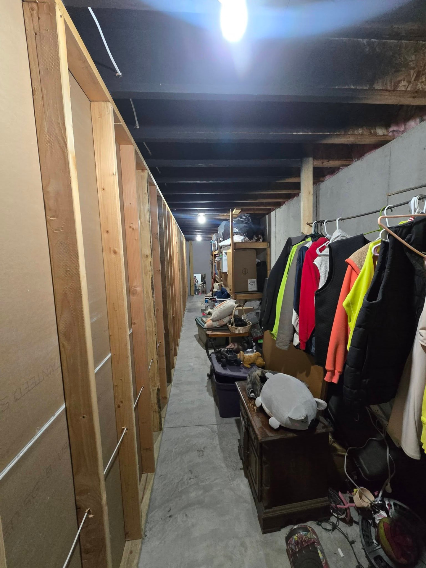 New walls framed in before drywall — the storage areas behind the finished space by B&R Construction
