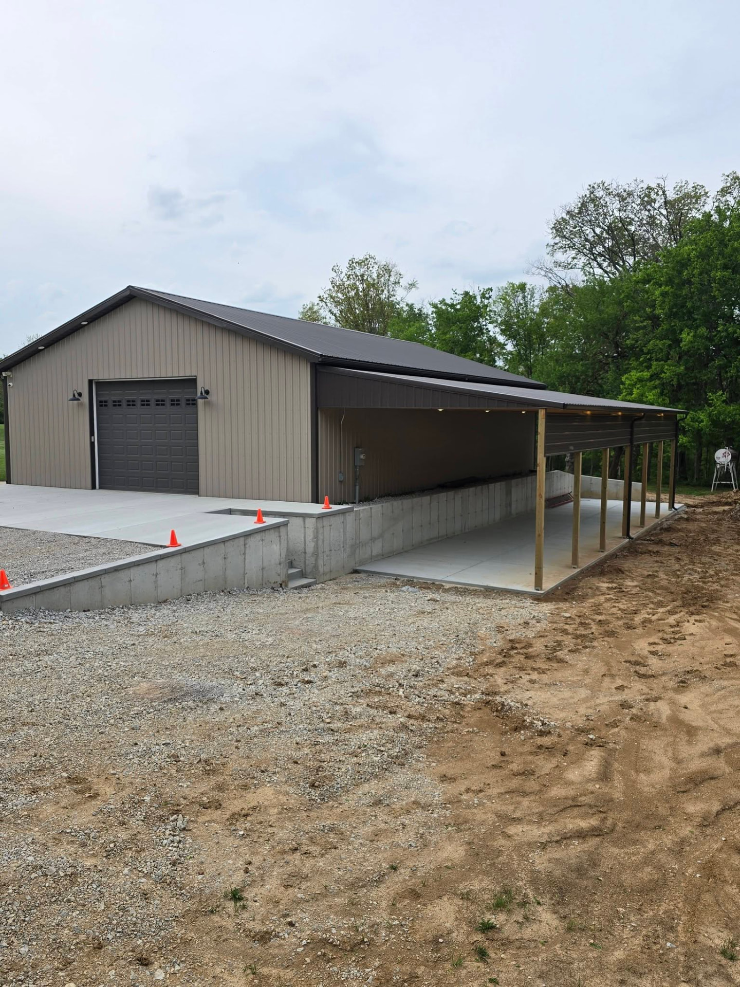 60' × 20' lean-to with a 13' 4" ceiling — tall enough for a fifth-wheel camper or anything you need covered by B&R Construction